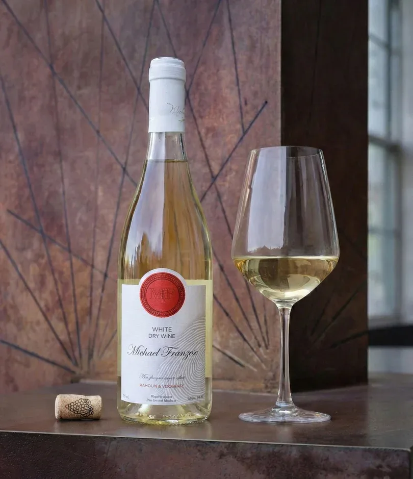 Sauvignon Blanc poured beside a window