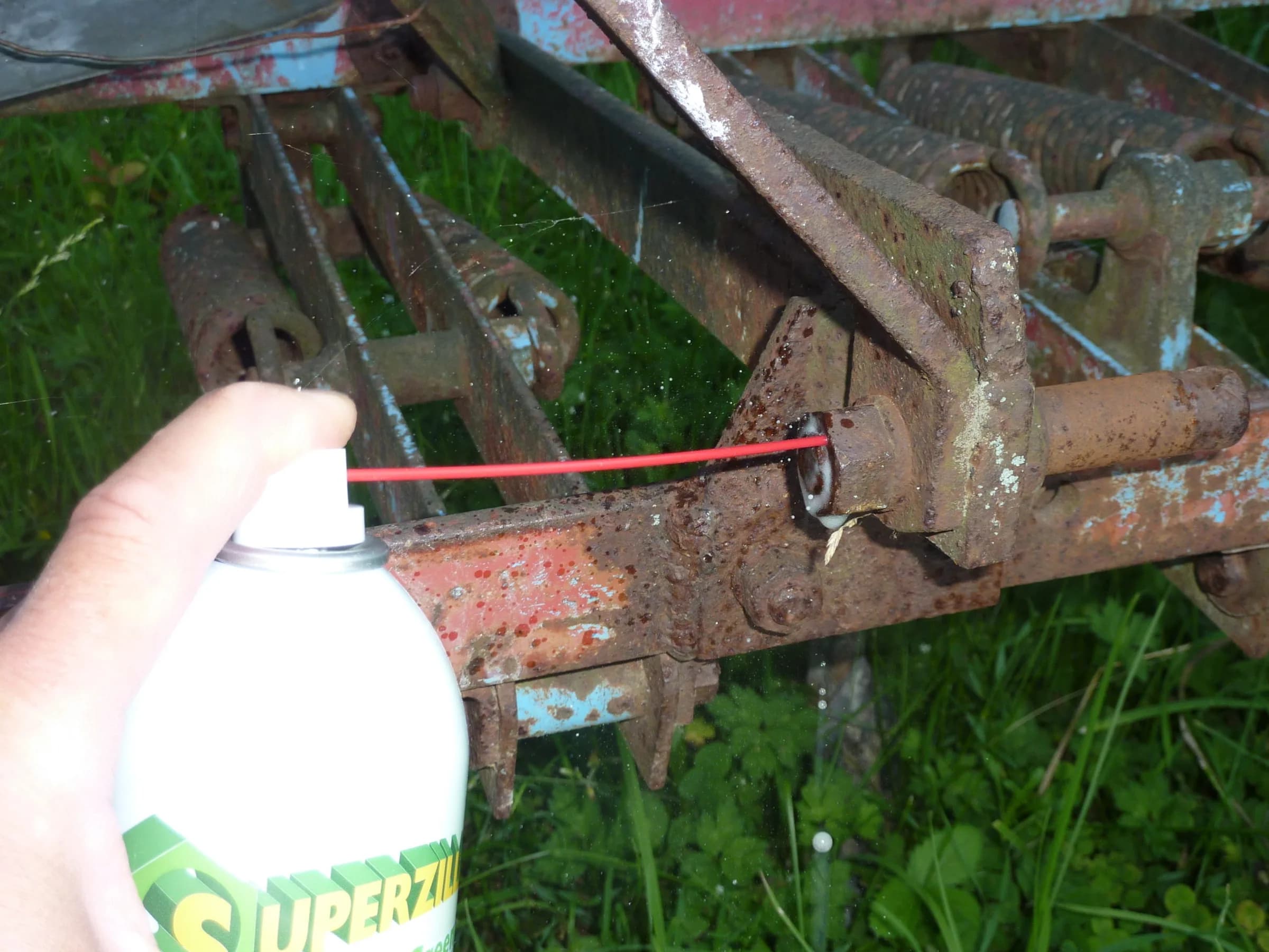 Superzilla sprayed onto a rusted farm bolt